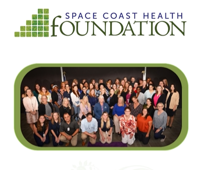 The staff of the space coast health foundation is gathered for a team photo.